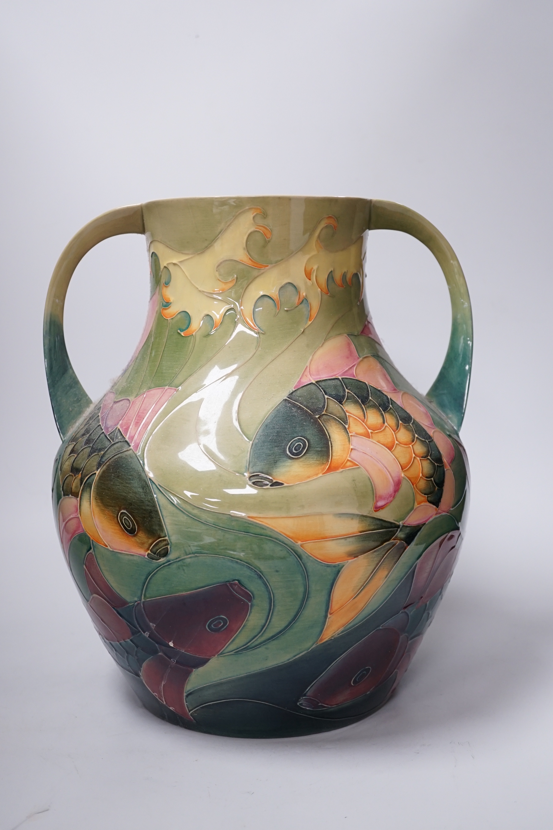Large Moorcroft ‘Carp’ vase with twin handles designed by Sally Tuffin decorated with carp, 33cm high
